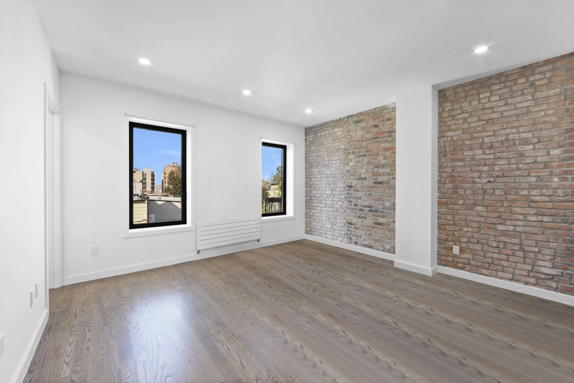 After declutter - clean room with exposed brick